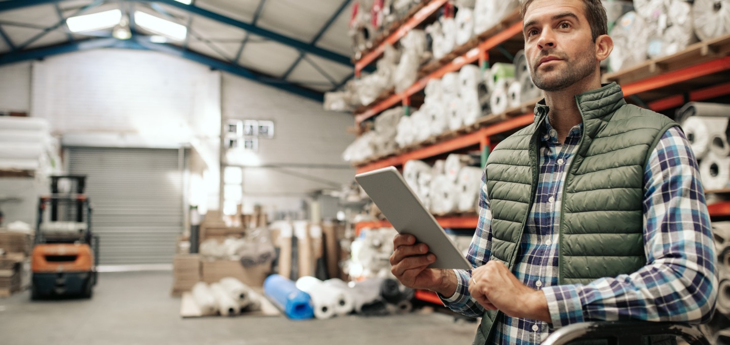 warehouse employee reviewing some documents