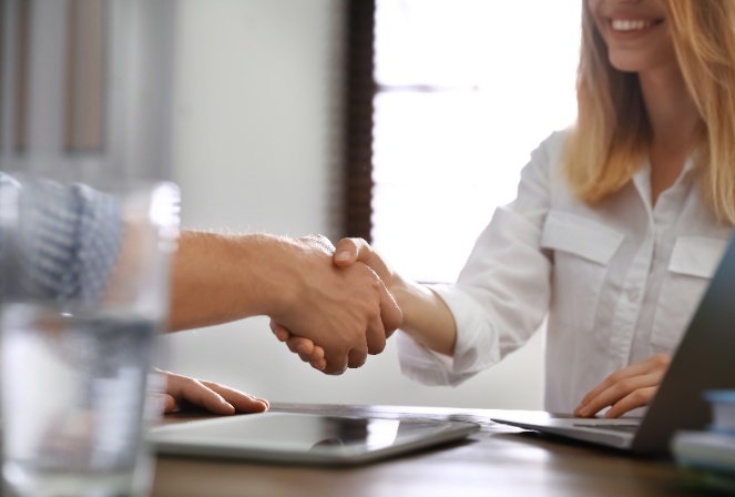 a man and woman shaking hands