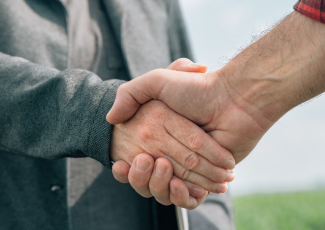 two men engaged in a handshake