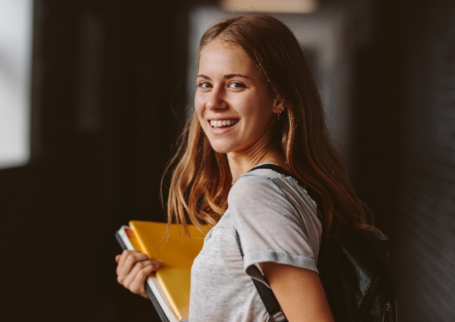 a young student smiling