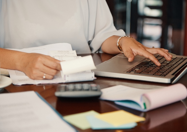 a person calculating her finances