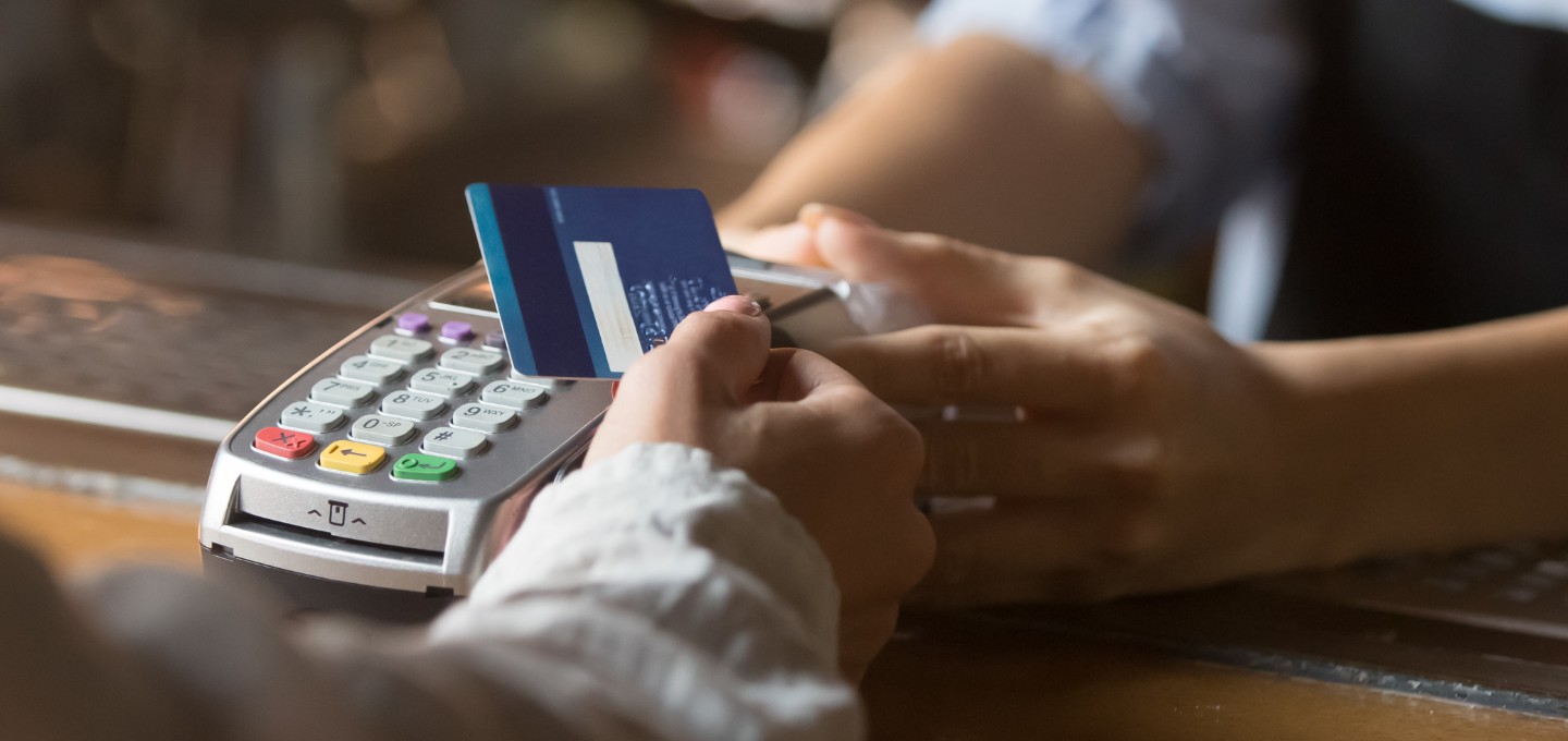 a personal making a purchase with their debit/credit card