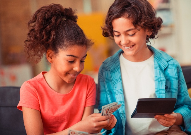 two kids learning how money works