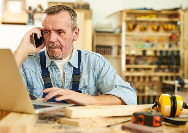 small business contractor viewing his laptop